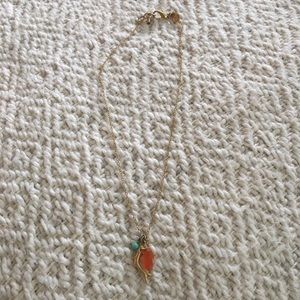 Delicate gold necklace with coral and stones